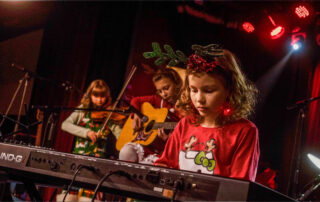 Kid Piano Students At Rock The Stages Music School in Aurora/Centennial Performing Live On Stage Best Beginner Piano