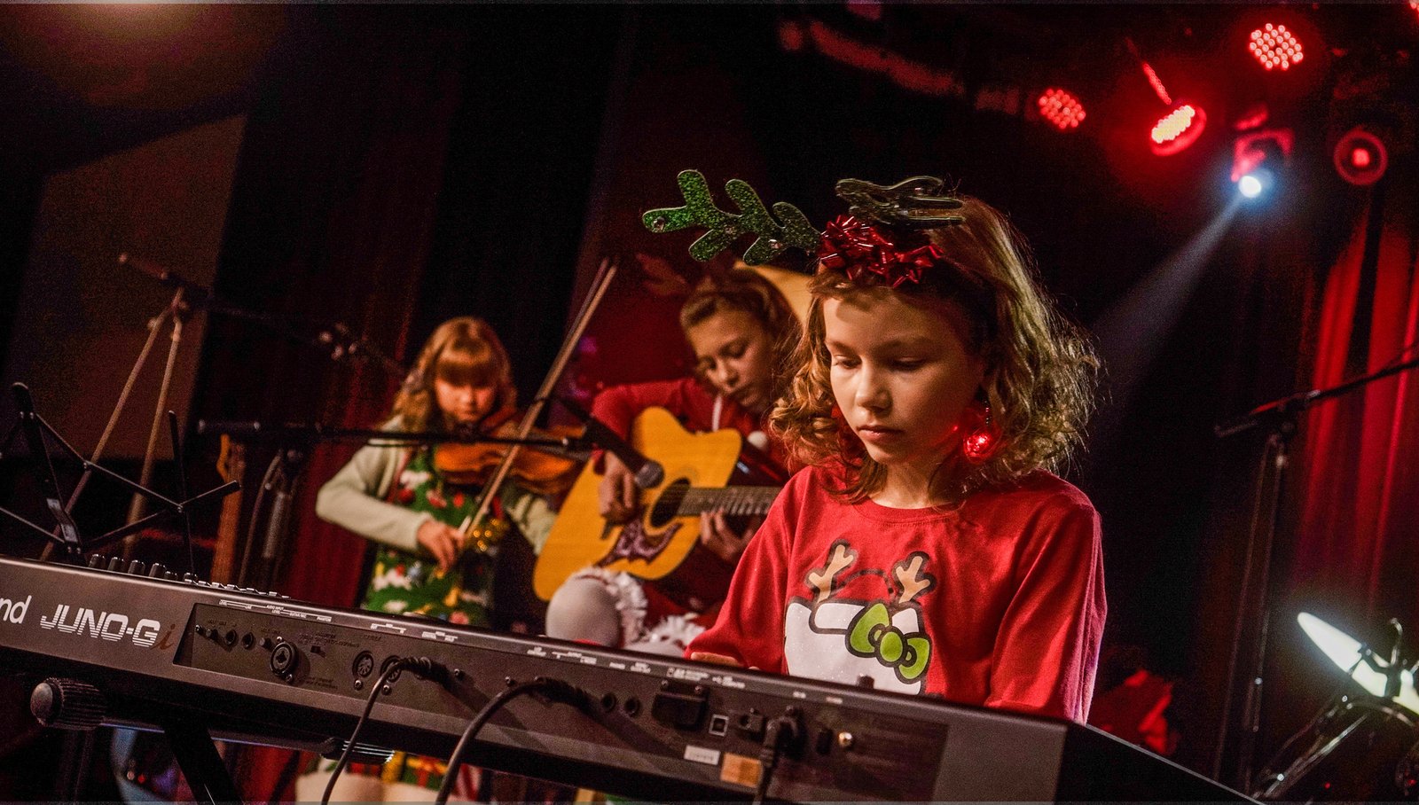 Piano Student Taking Piano Lessons From A Local Piano Teacher In Aurora/Centennial Kid Piano Students At Rock The Stages Music School in Aurora/Centennial Performing Live On Stage