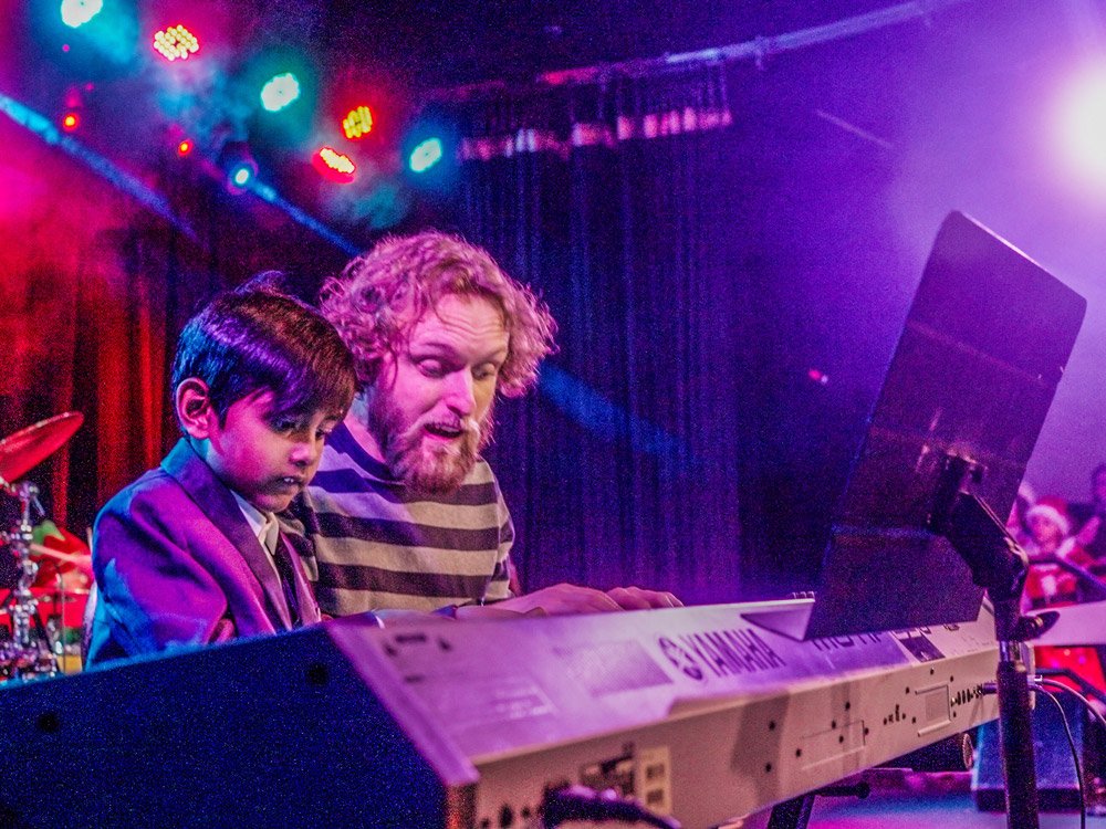 Piano Students Taking Piano Lessons From A Local Piano Teacher In Aurora/Centennial Kid Piano Student At Rock The Stages Music School in Aurora/Centennial Performing Live On Stage