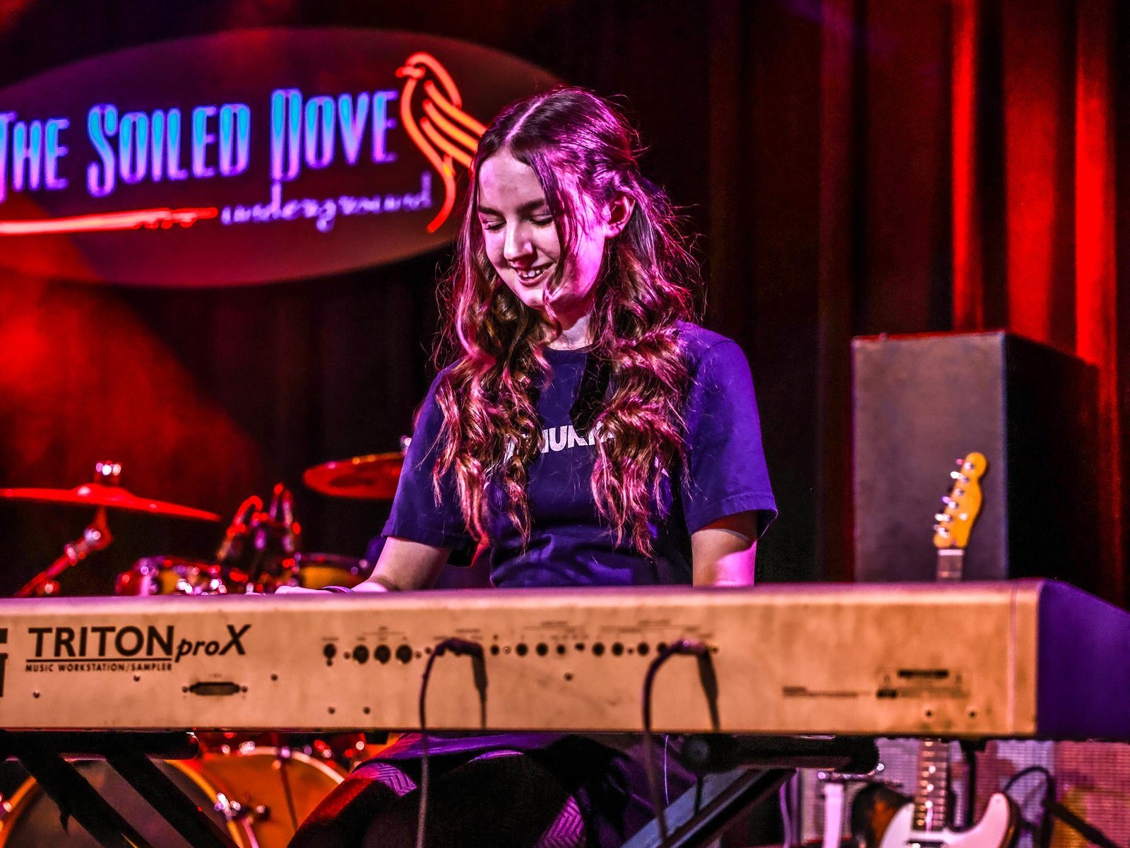 Piano Student Taking Piano Lessons From A Local Piano Teacher In Aurora/Centennial Teenage Piano Students At Rock The Stages Music School in Aurora/Centennial Performing Live On Stage