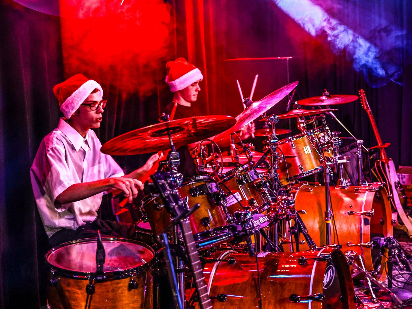 Drum Students Taking Drum Lessons From A Local Drum Teacher Teenage Drum Students At Rock The Stages Music School in Aurora/Centennial Performing Live On Stage