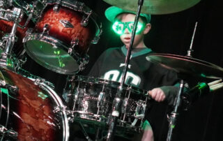 Kid Drum Student At Rock The Stages Music School in Aurora/Centennial Performing Live On Stage Best Beginner Drums