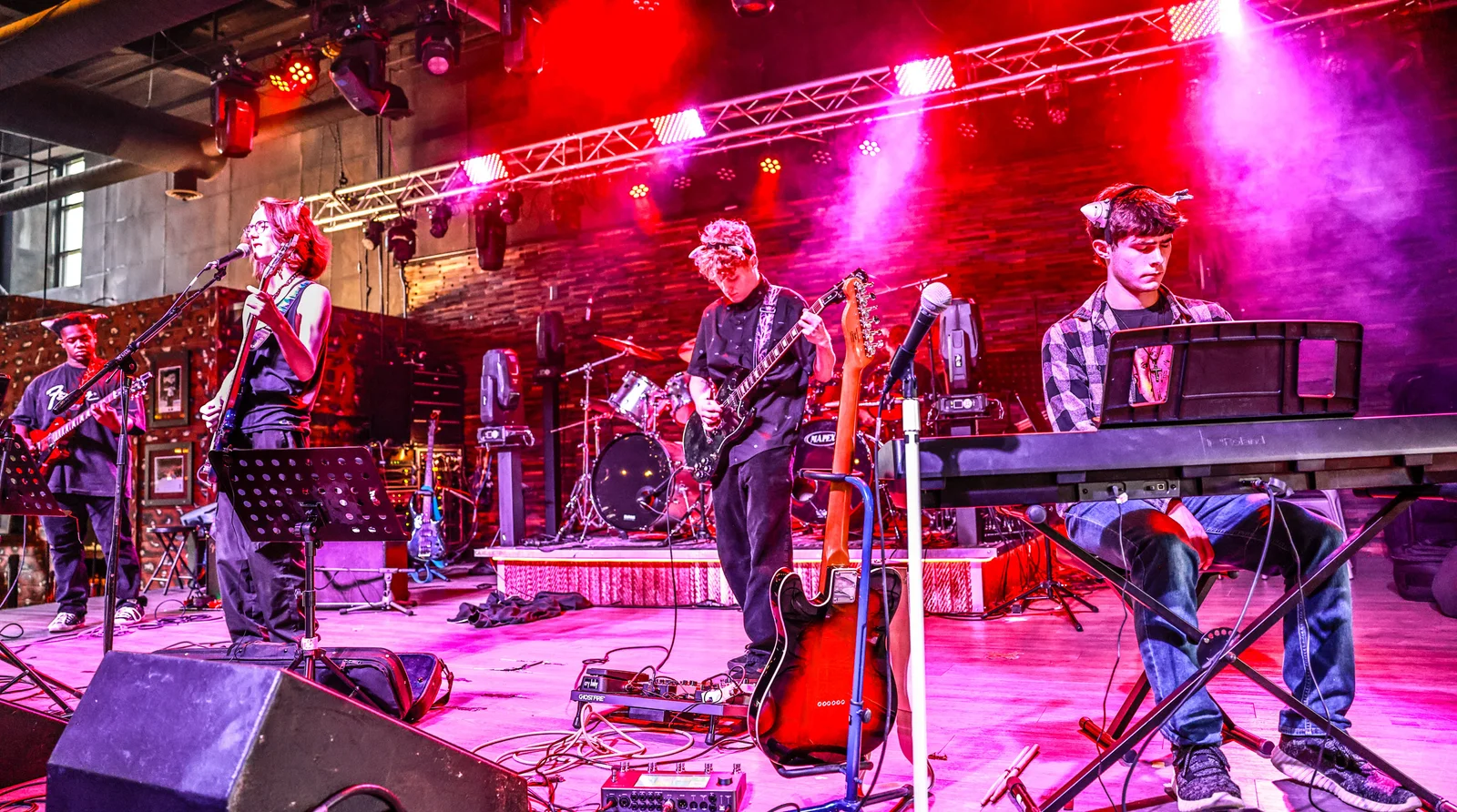Students rehearsing in a rock band ensemble